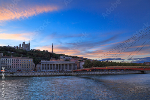 Colorful sunset over the Saone river and the Basilique Notre-Dame de Fourviere in the city of Lyon, France.
