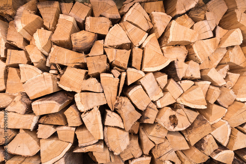 Background of dry chopped firewood logs