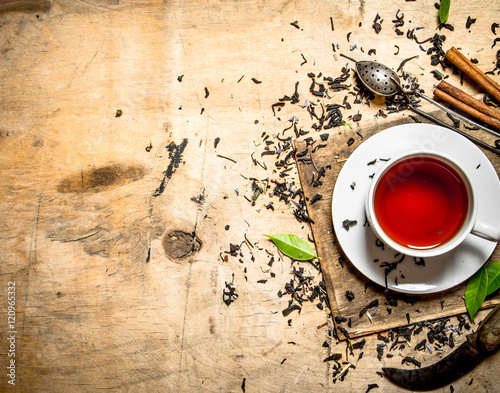 Tea with leaves and cinnamon.