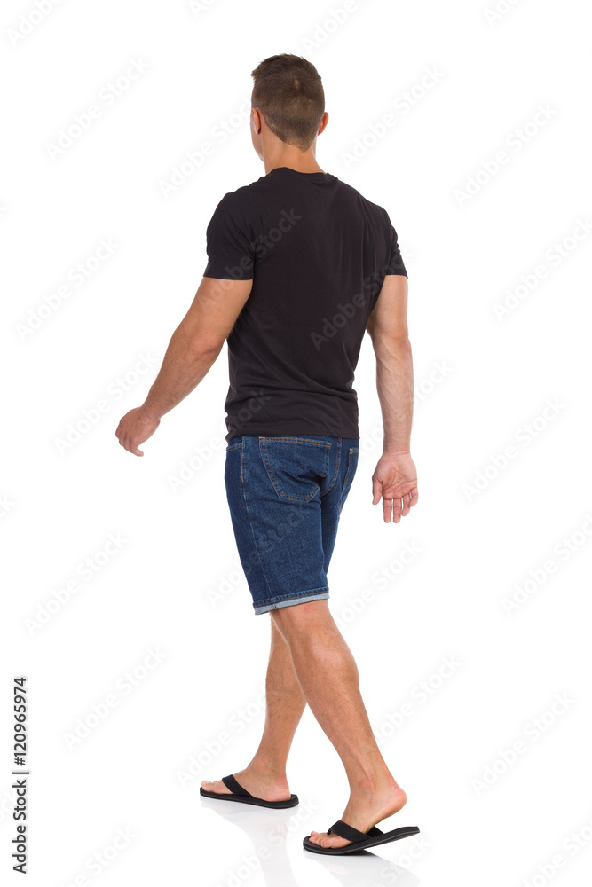 Man Walking In Flip-Flops. Rear Side View Man Walking In Flip-Flops. Rear Side View