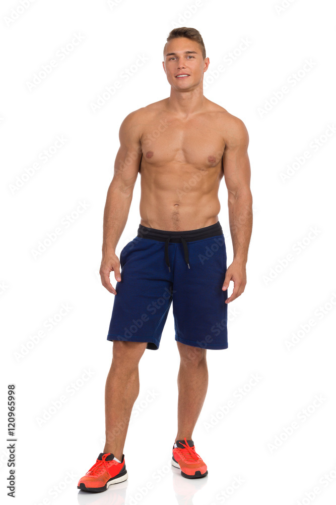 Fit Young Man In Blue Shorts Posing Fit Young Man In Blue Shorts Posing