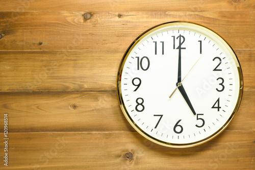 wall clock on the wooden wall