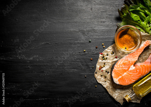 Raw salmon with olive oil, spices and herbs.