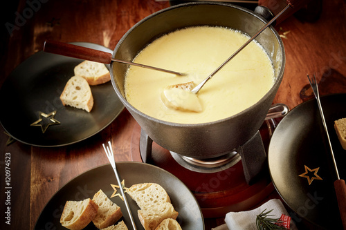 Enjoying a cheese and wine fondue in winter