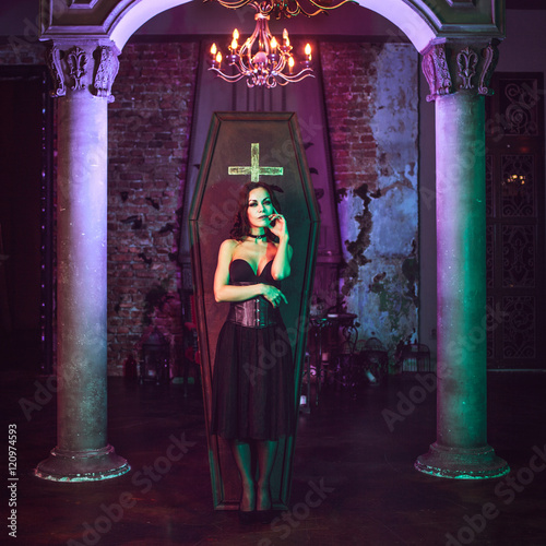 Photo Beautiful and sexy vampire in her mansion. Halloween