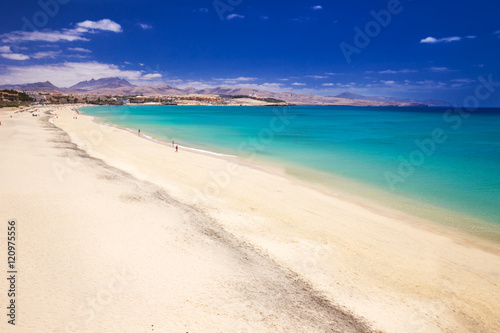 Costa Calma sandy beach with vulcanic mountains in the background, Jandia, Fuerteventura island, Canary Islands, Spain.