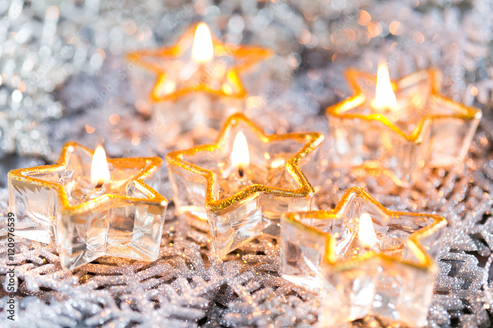 Golden burning candles bokeh blured background. Golden burning candles bokeh blured background.