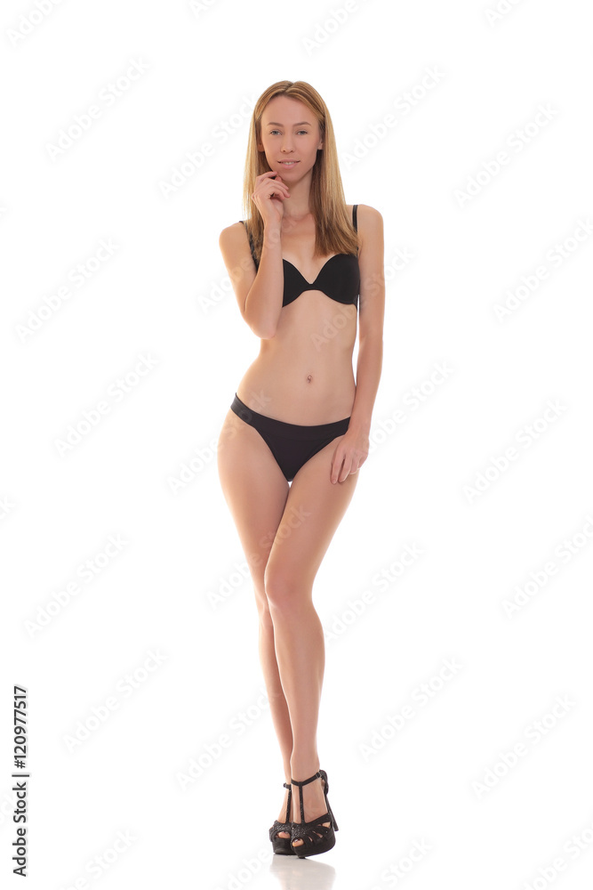 young blond woman posing in black lingerie. young blond woman posing in black lingerie.