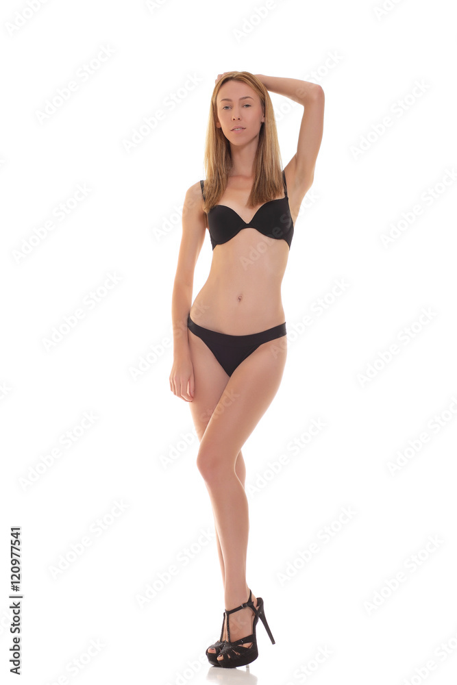 young blond woman posing in black lingerie. young blond woman posing in black lingerie.