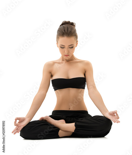 Yoga. Girl meditating sitting in lotus position