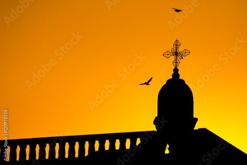 church silhouette and pigeons photo