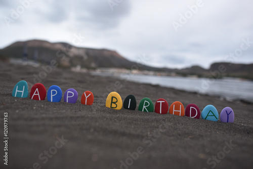 Fototapeta Naklejka Na Ścianę i Meble -  Happy multicolored Birthday message on black sand, Vulcano island, Sicily, Italy