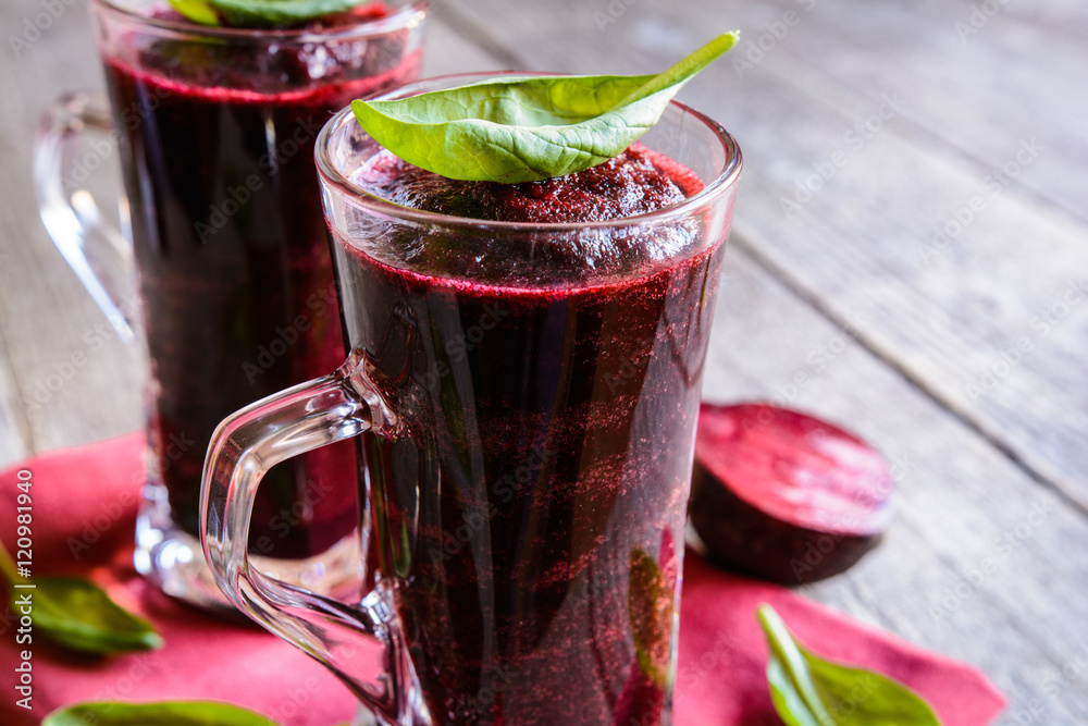 Beetroot smoothie with spinach and lemon in a glass jar Beetroot smoothie with spinach and lemon in a glass jar