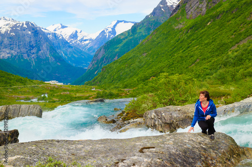 Tourist woman by Videfossen Waterfall in Norway © Voyagerix