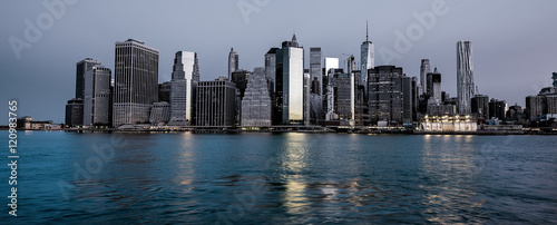 New York Skyline at night with water reflection