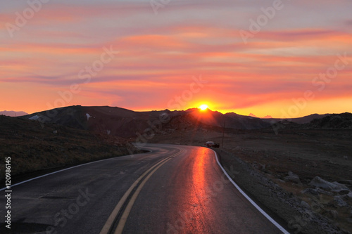 Mountain road under sun set