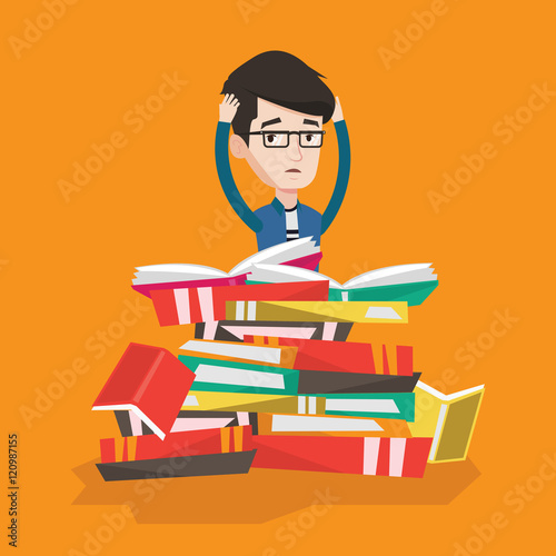 Student sitting in huge pile of books.