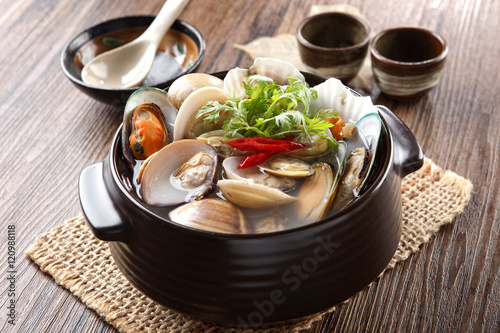 Black stew of Jogaetang clam soup with chili and cumin herbs on