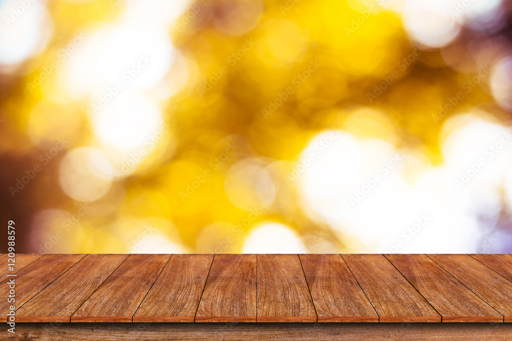 Wood table top on bokeh abstract background - can be used for mo Wood table top on bokeh abstract background - can be used for mo