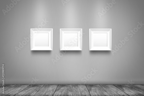 Collage of three white photo frames on the wall © artpritsadee