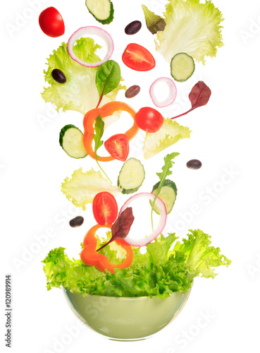 Fototapeta Naklejka Na Ścianę i Meble -  Salad flying to the bowl