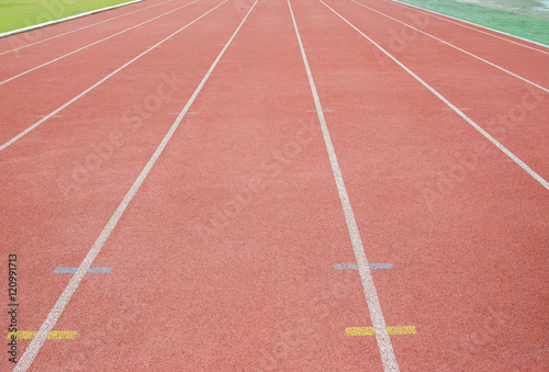 Red running track in stadium.