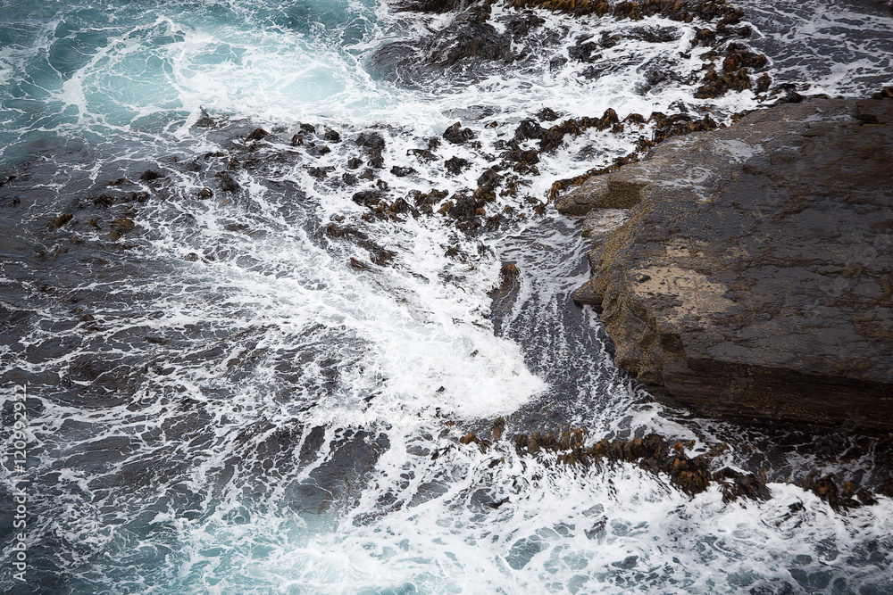 Waves crashing on Rocks