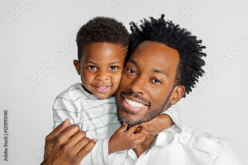 African American Father and Son Hug For A Portrait