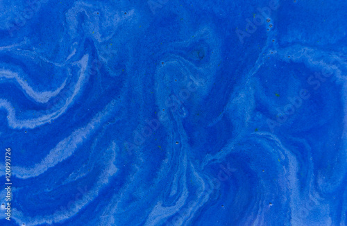 Dark blue liquid background. Marbled pattern. Acrylic surface
