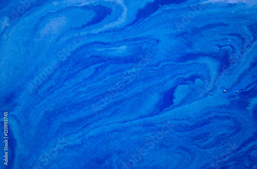 Dark blue liquid background. Marbled pattern. Acrylic surface