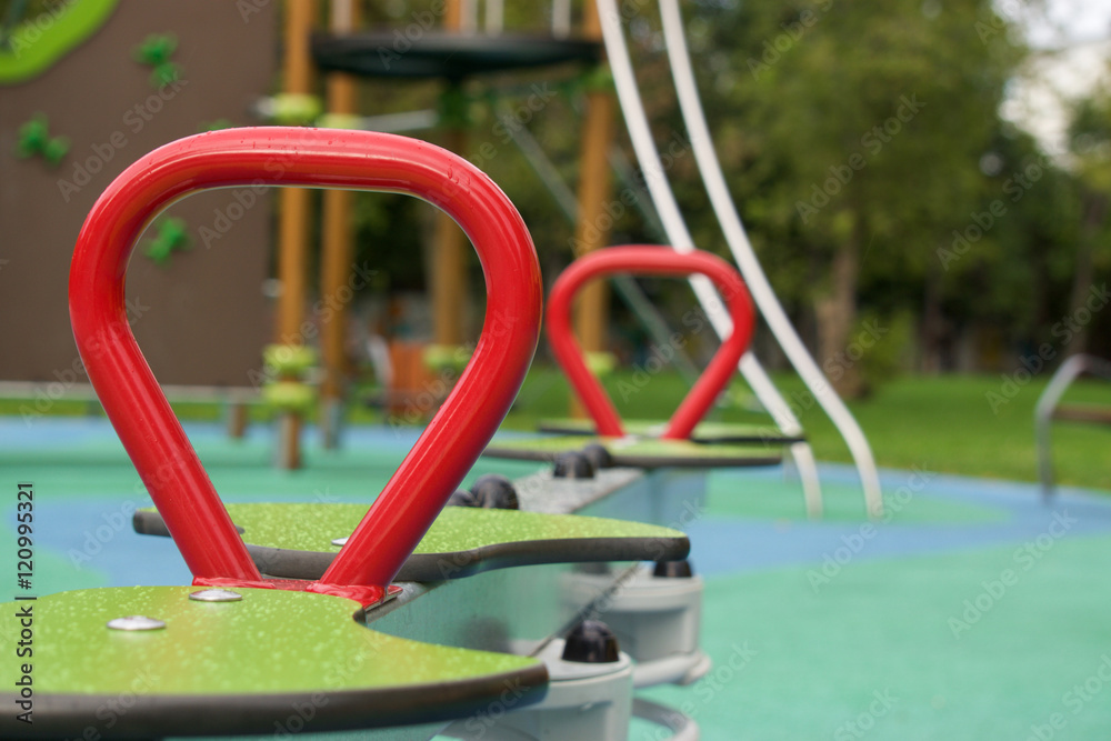 red pen on the swings at the playground red pen on the swings at the playground