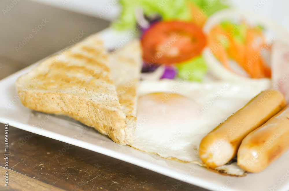 sausage, toast ,fried egg ,ham and vegetable  or  breakfast