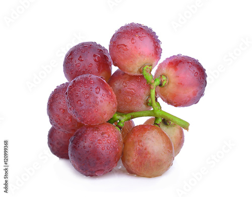fresh red grapes with water drops isolated on white