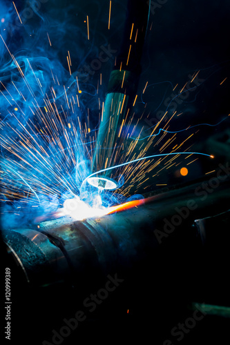 robots welding in a car factory