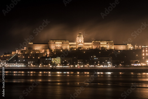 Photography Budapest parliament at night over the Danube river