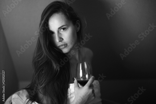 young woman a glass of wine house