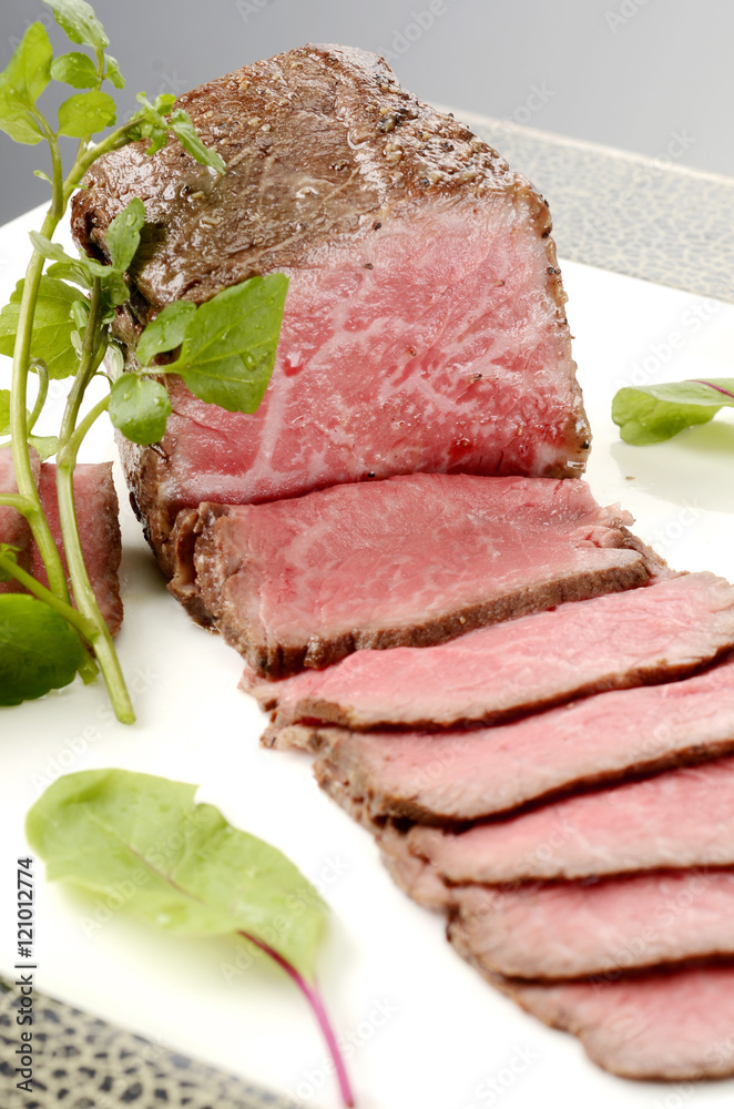 Roast beef of charm and character on white plate