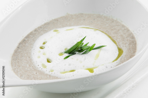 Mushroom cream soup "cappuccino" on white bowl