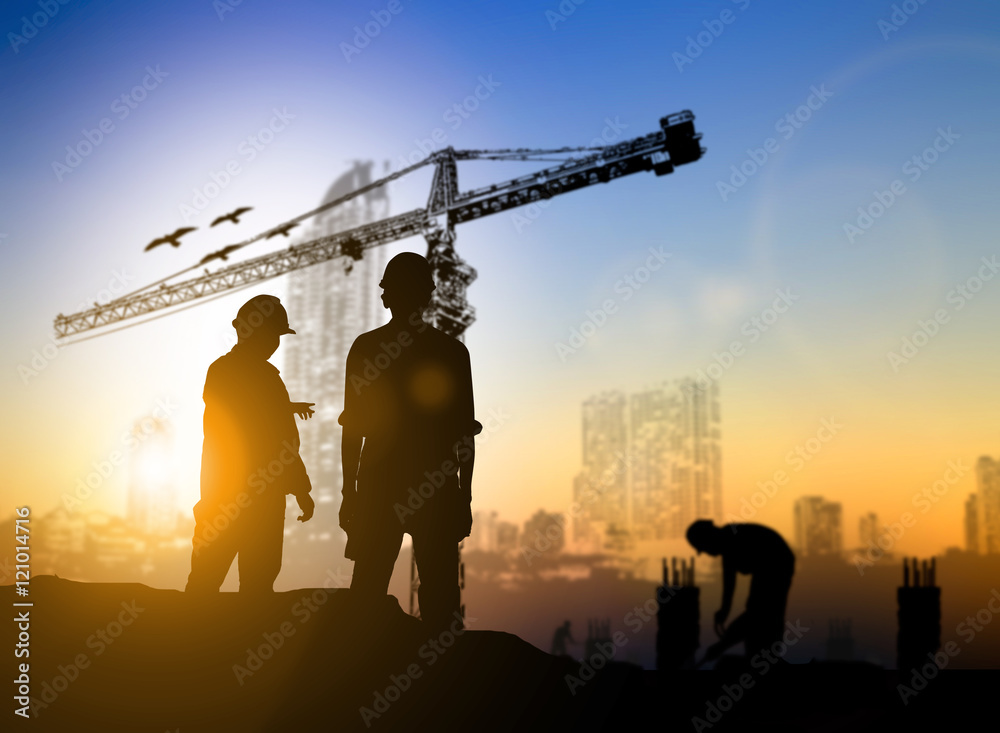 Fototapeta premium silhouette engineer construction site over Blurred construction