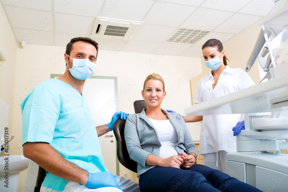 Adult woman getting her checkup at the Dentist Adult woman getting her checkup at the Dentist