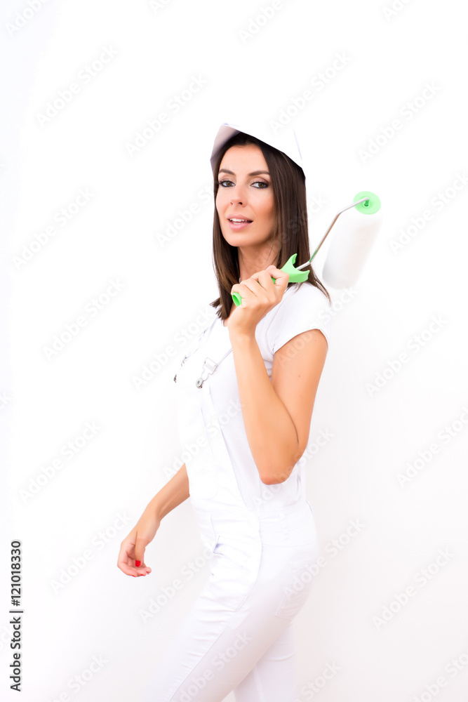 Beautiful young woman painting a Apartment Beautiful young woman painting a Apartment