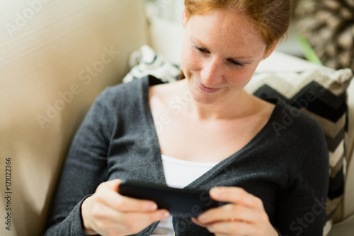 Woman Watching a Clip on a Smartphone