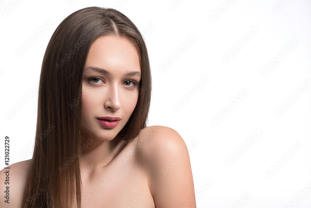 Cute young woman posing with naked shoulders Cute young woman posing with naked shoulders