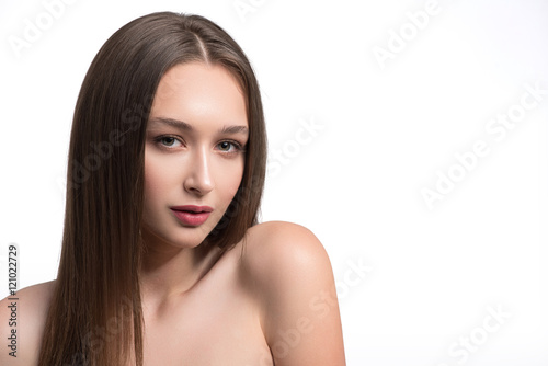 Cute young woman posing with naked shoulders