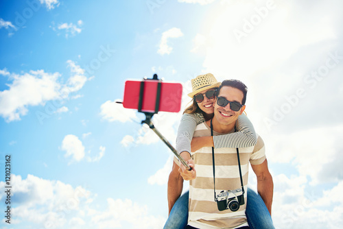 Happy young couple having fun taking a selfie