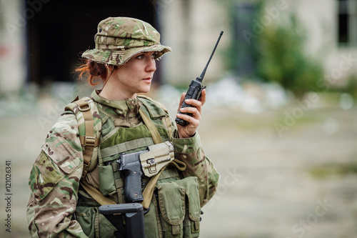 soldier holds a radio station, and give orders subdivision.