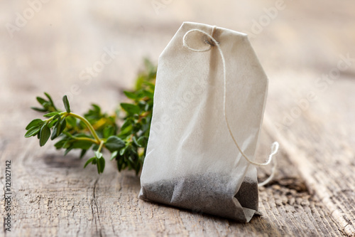 tea bag and fresh thyme