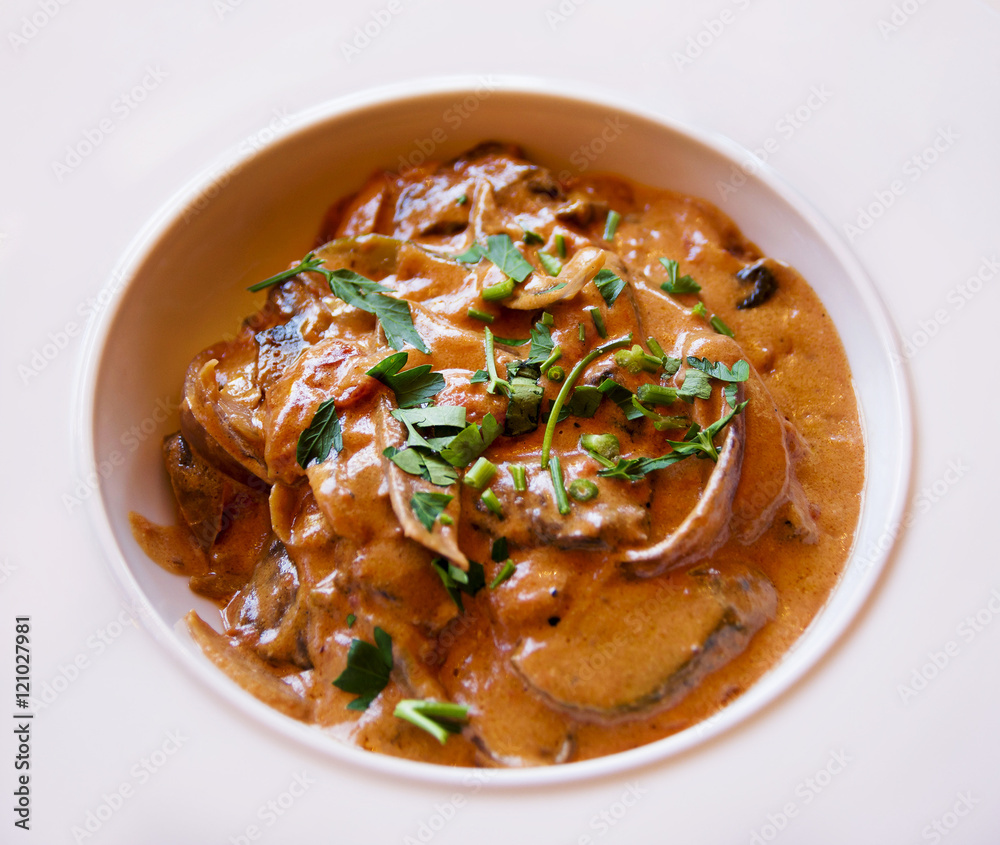 Beef Stroganoff with fresh parsley , close up Beef Stroganoff with fresh parsley , close up