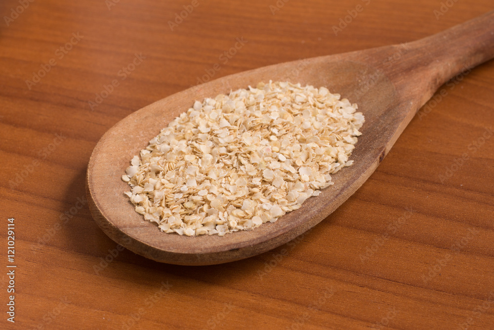 Quinoa Flakes into a spoon. Quinoa Flakes into a spoon.