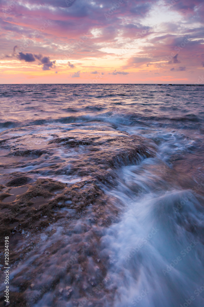 Long exposure sea and rocks at twilight Long exposure sea and rocks at twilight